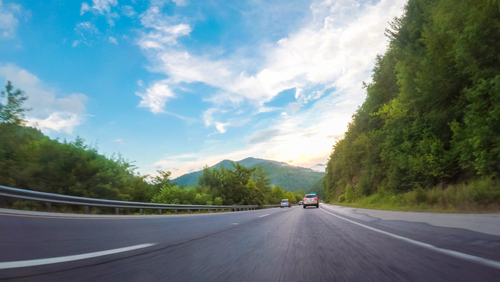 Dashcam POV of an open highway.