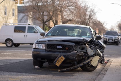 black car with front end wrecked from accident