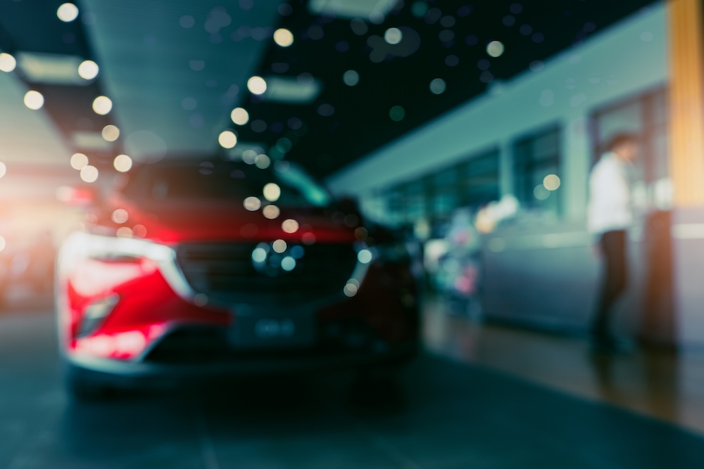 Out of focus front of a red car